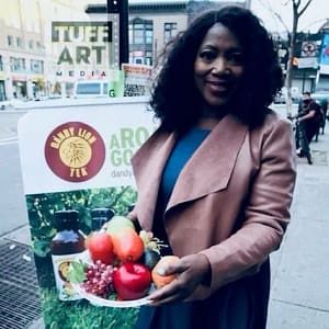 Picture of Registered Dietitian Gloria Bent holding a fruit plate at an event.